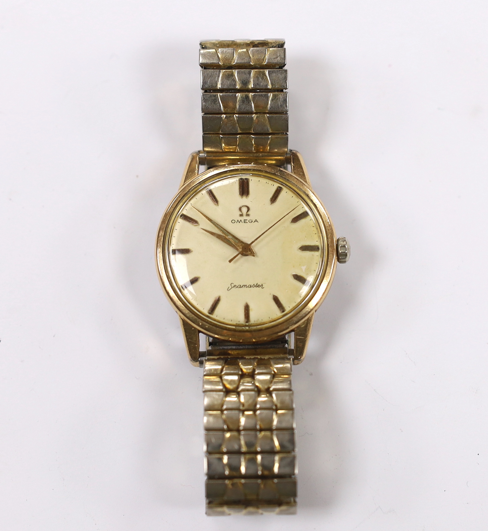 A gentleman's steel and gold plated Omega Seamaster manual wind wrist watch, cased diameter 35mm, on a later associated flexible bracelet.